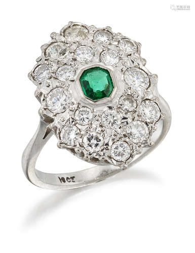 AN EMERALD AND DIAMOND CLUSTER RING