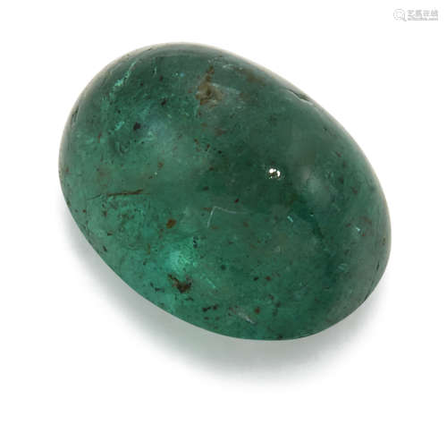 AN OVAL CABOCHON EMERALD