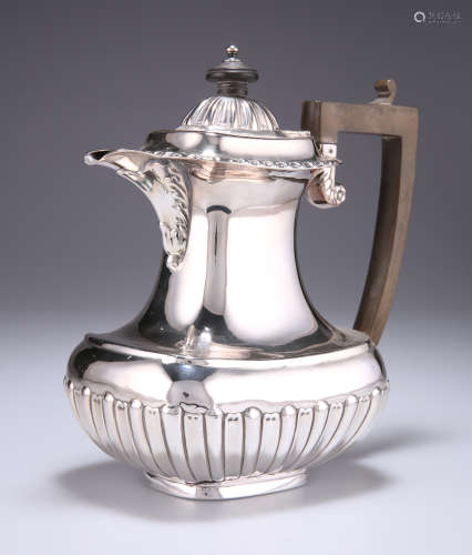 A LATE VICTORIAN SILVER HOT WATER JUG