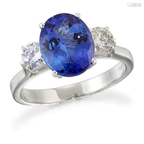 AN 18 CARAT WHITE GOLD TANZANITE AND DIAMOND THREE-STONE RIN...