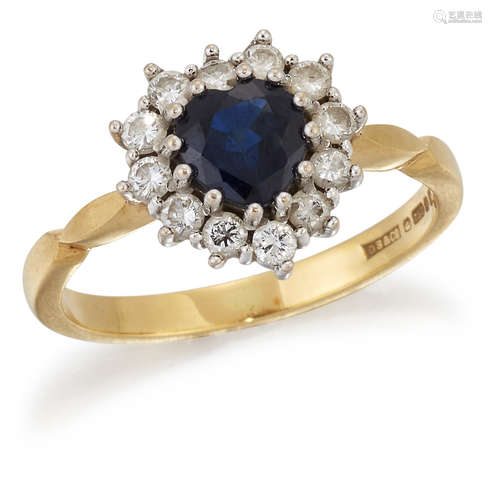 AN 18 CARAT GOLD SAPPHIRE AND DIAMOND CLUSTER RING