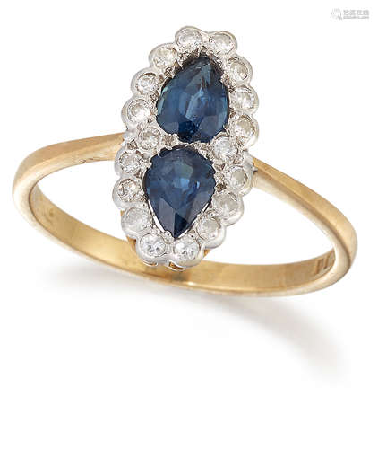 AN 18 CARAT GOLD SAPPHIRE AND DIAMOND CLUSTER RING