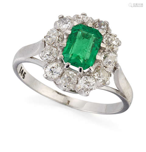 AN EMERALD AND DIAMOND CLUSTER RING