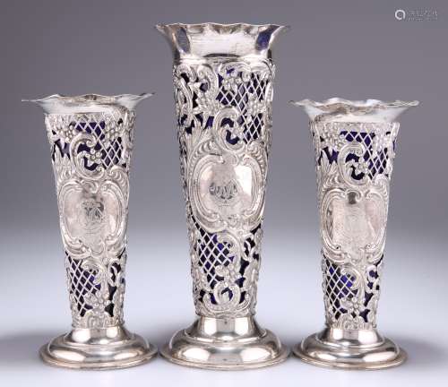 A GARNITURE OF THREE VICTORIAN SILVER VASES