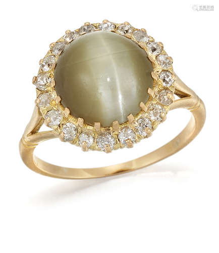 A CAT'S EYE CHRYSOBERYL AND DIAMOND CLUSTER RING