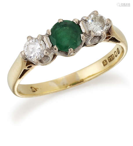 AN 18 CARAT GOLD EMERALD AND DIAMOND THREE-STONE RING