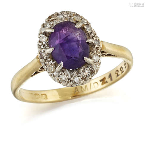 AN 18 CARAT GOLD AMETHYST AND DIAMOND CLUSTER RING