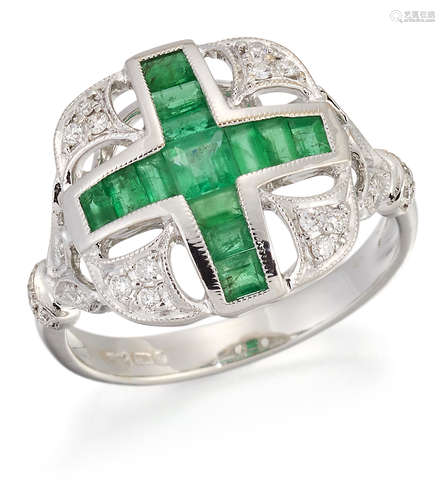 AN 18 CARAT WHITE GOLD EMERALD AND DIAMOND RING