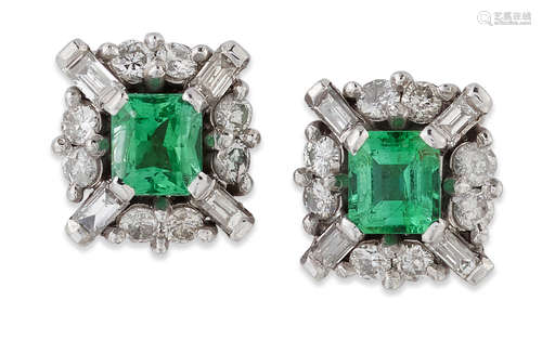 A PAIR OF 18 CARAT WHITE GOLD EMERALD AND DIAMOND CLUSTER ST...