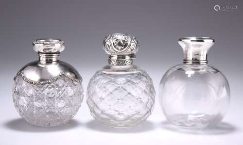 A GROUP OF THREE SILVER-MOUNTED GLASS SCENT BOTTLES