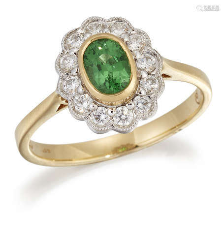 AN 18 CARAT GOLD TSAVORITE GARNET AND DIAMOND CLUSTER RING