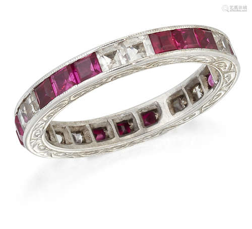 A RUBY AND WHITE SAPPHIRE ETERNITY RING