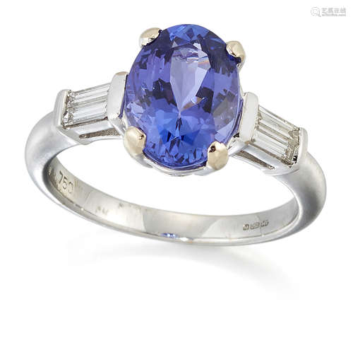 AN 18 CARAT WHITE GOLD TANZANITE AND DIAMOND THREE-STONE RIN...