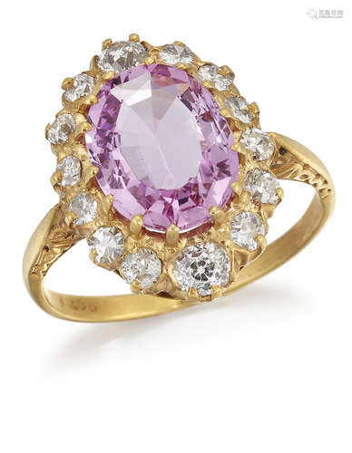 A PINK TOPAZ AND DIAMOND CLUSTER RING