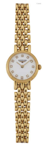 A LADY'S 18 CARAT GOLD LONGINES BRACELET WATCH