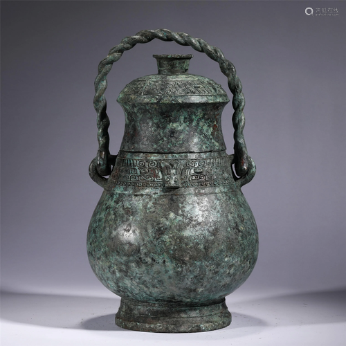 A CHINESE BRONZE WARE LONG HANDLE POT