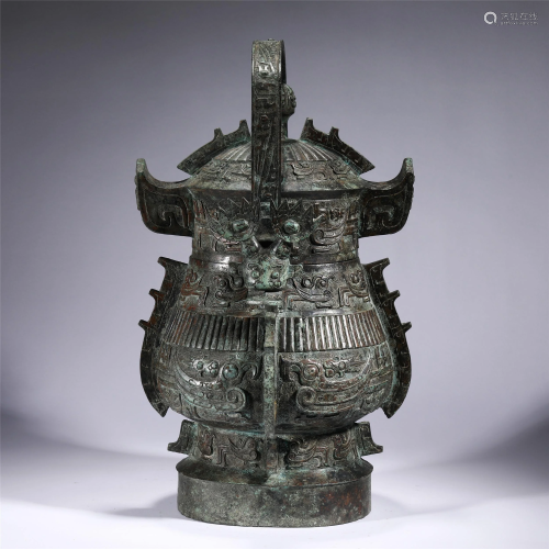A CHINESE BRONZE WARE LONG HANDLE POT
