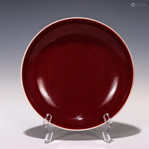 A CHINESE RED GLAZED PORCELAIN PLATE