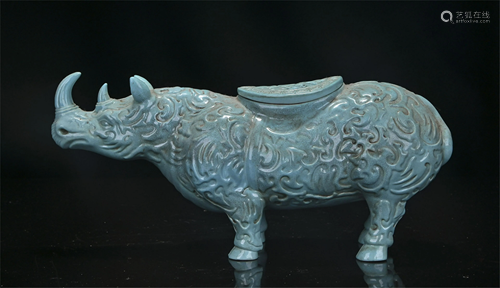 A CHINESE BLUE GLAZED PORCELAIN RHINOCEROS