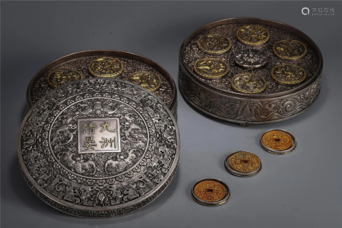 A SET OF CHINESE GILT SILVER COINS
