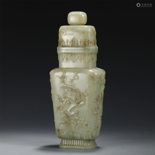 A CHINESE CARVED JADE VASE WITH COVER