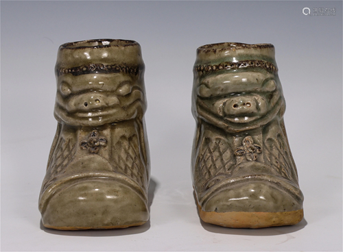 A CHINESE YUE TYPE GLAZED PORCELAIN SHOES