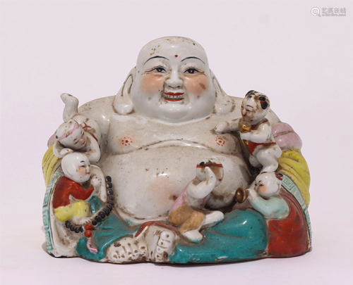 A CHINESE FAMILLE ROSE PORCELAIN FIGURE OF BUDDHA