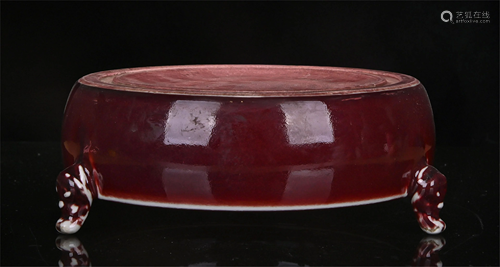 A CHINESE RED GLAZED PORCELAIN TRIPOD INKSTONE