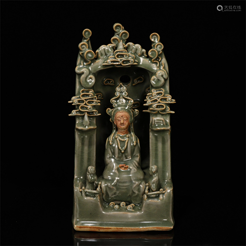 A CHINESE CELADON GLAZED PORCELAIN FIGURE OF GUANYIN