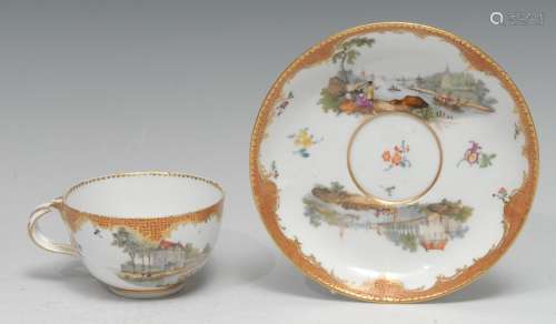 A Meissen teacup and saucer, well-painted with harbour scene...