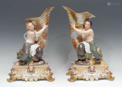 A pair of 19th century Baroque Revival porcelain figural cor...