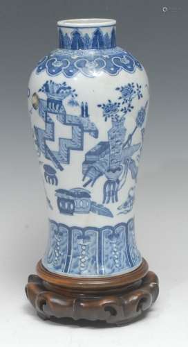 A Chinese baluster vase, painted in tones of underglaze blue...