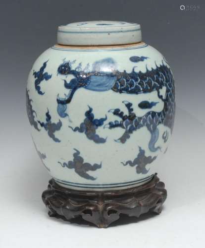 A Chinese ovoid ginger jar and cover, painted in underglaze ...
