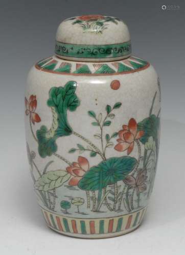 A Chinese ovoid jar and cover, painted in the famille verte ...