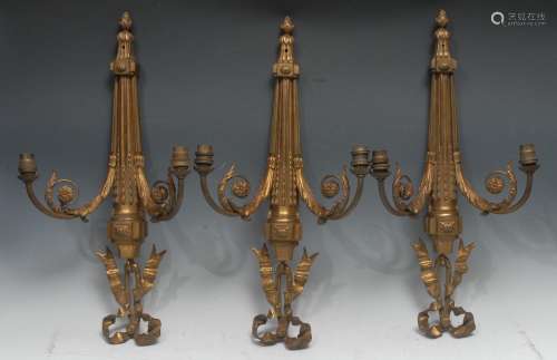 A garniture of three Louis XVI Revival gilt-brass two branch...