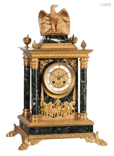 A French ormolu and verde antico marble mantel clock in the ...