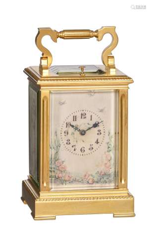 Y A French gilt brass carriage clock with painted ivory pane...