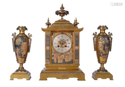 A French brass mantel clock garniture with relief cast panel...