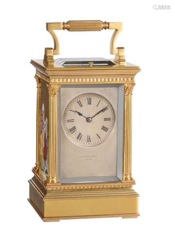 A fine French gilt brass carriage clock with painted porcela...