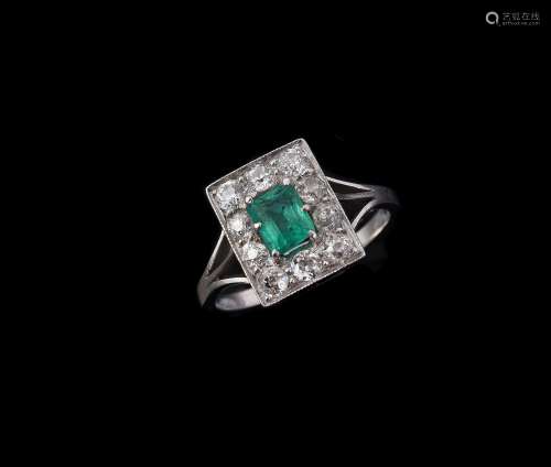 A mid 20th century diamond and emerald cluster ring