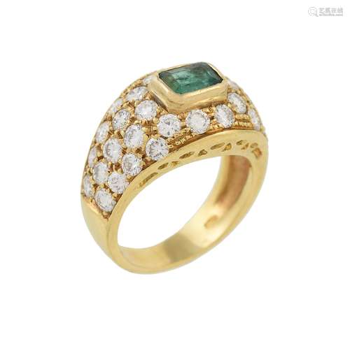 A diamond and emerald dress ring