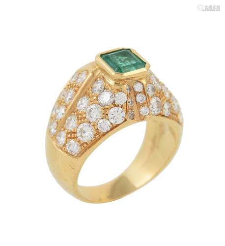 An emerald and diamond dress ring