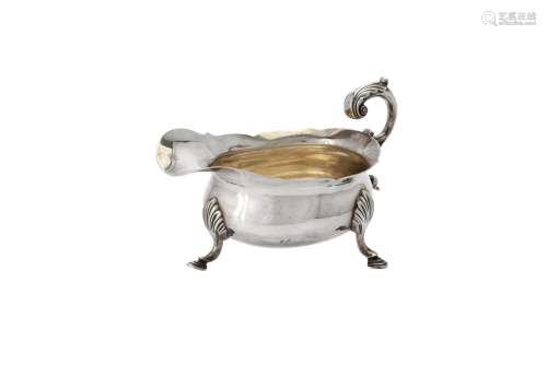 A William IV silver shaped oval sauce boat by Michael Starke...