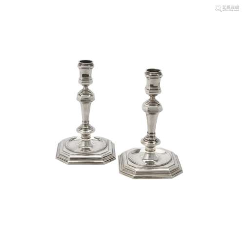 A pair of cast silver candlesticks by Spink & Son
