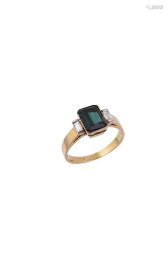 A green tourmaline and diamond three stone ring