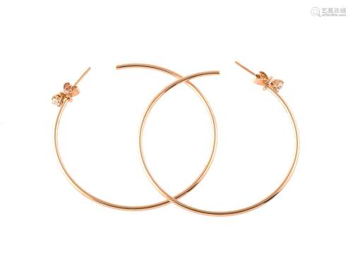 A pair of diamond accented ear hoops by Anita Ko