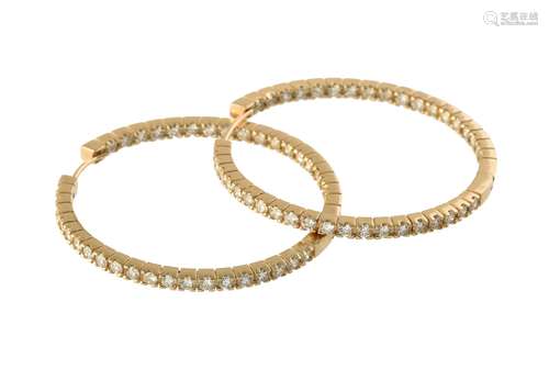 A pair of diamond ear hoops