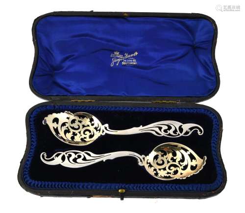 A cased pair of Edwardian silver sifter spoons by Josiah Wil...