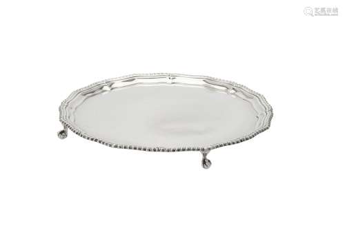 A silver shaped circular salver by Barker Brothers Silver Lt...