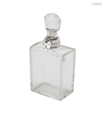 An Edwardian silver mounted lockable glass decanter